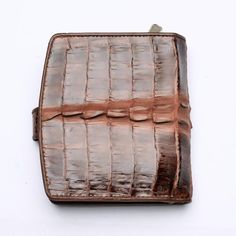 River twotone dark brown genuine crocodile tail skin leather wallet ~ new    Favour timeless leather goods and choose our TwoTone Brown Crocodile Skin Women's Wallet. Crafted to last, this understated walled exudes a demure elegance that everyone will notice. We use high-grade crocodile leather and celebrate all of its unique markings with a two-tone brown dye.      This picks up on all the intricate wrinkles and scales across the body, while also allowing it to pair effortlessly with the other Brown Business Wallets With Crocodile Pattern, Brown Crocodile Pattern Business Wallet, Formal Brown Wallet With Crocodile Pattern, Crocodile Tail, Womens Wallets, Crocodile Skin, Shades Of Brown, Crocodile Leather, Leather Goods