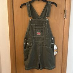 Revolt Clothing Co Women’s Shortalls Overalls In Army Green. Brand New With Tags. Y2k, 90s. Measures 32 Inches In Total Length And 4 Inch Inseam. Size Women’s Large. Revolt Overalls, Cool Outfits Aesthetic, Green Dungarees, Character Chart, Green Overalls, Overalls Outfit, Male Clothes, Gardening Outfit, Jean Overalls