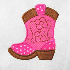 a pink cowboy boot with flowers on it