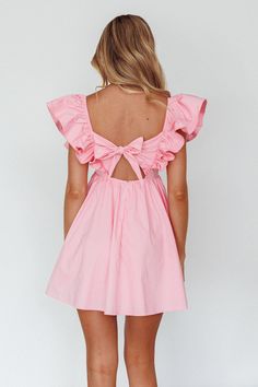 Soft pink mini dress Lined Ruffle sleeves Tie feature in back Zipper in back You'll look like an angel in our ethereal Marlina mini dress. We are in love with its babydoll silhouette and super cute ruffle sleeves. Perfect for a birthday party or date night. Team it with white, tie up heels and a purse for a look that's straight from Heaven. MODEL INFO Model is wearing size XS Height: 5'7" Bust: 32" Waist: 23.6" Hips: 32.5" SIZE INFO Flat garment measurements This was manually measured from the a Preppy Dresses Pink, Tea Party Mini Dress, Pink Dresses Mini, Ruffled Short Dress, Pink Love Shack Fancy Dress, Mini Spring Dress, Semi Formal Sorority Dresses, Cute Mini Dress With Tie Back, Feminine Mini Dress With Puff Sleeves And Ruffles