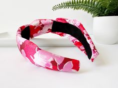 ∙ Red and pink floral print∙ 1 1/2" knot and 2 1/2" side width∙ 1" comfort fit width band This beautiful summer floral knotted silk headband is the perfect accessory to add a touch of elegance and comfort to any outfit. The lightweight and silky soft material gently rests on your head, providing a cozy and comfortable fit all day long. The delicate floral print adds a touch of feminine charm, while the knotted design at the top adds a touch of bohemian chic. The headband is perfect for keeping y Pink Summer Headband, Red Headband For Spring, Red Headband Hair Accessories For Spring, Red Spring Headband, Adjustable Red Headband For Spring, Adjustable Red Headband For Summer, Silk Headband, Pink Summer, Summer Floral