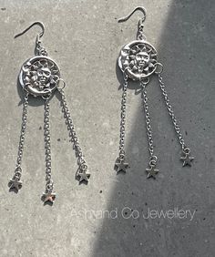 Sun, moon and stars earrings for pierced ears. Fabulous earrings, for everyday wear or festivals. Measures Drop from earring hook 12.5 cm Width of charm 3.7 cm Thank you Celestial Silver Earrings With Star Charm, Silver Crescent Earrings With Star Charm, Silver Celestial Earrings With Dangling Charms, Celestial Silver Earrings With Dangling Charms, Bohemian Silver Star-shaped Earrings, Bohemian Silver Star Earrings, Silver Star Earrings For Summer, Silver Moon Earrings For Festivals, Metal Dangle Earrings With Star Charm