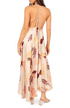 A bold tropical pattern highlights the flowy, asymmetric skirt of this stunning T-back halter dress. Ties at back Deep V-neck Adjustable straps High-low hem Lined 100% polyester Hand wash, dry flat Imported Sleeveless Tropical Beach Dress For Brunch, Tropical Sleeveless Beach Dress For Brunch, Spring Beach Maxi Dress With Cutout Back, Tropical Floral Print Maxi Dress With Spaghetti Straps, Summer Floral Print Backless Dress, Floral Print Maxi Length Backless Beach Dress, Floral Print Maxi Backless Dress For Beach, Spring Beach Backless Dress With Cutout Back, Beach Backless Maxi Dress With Floral Print