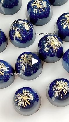 blue and white marbles with gold fireworks on them