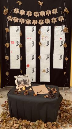 the table is covered with leaves and papers