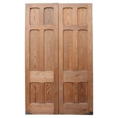 two wooden doors are open on a white background