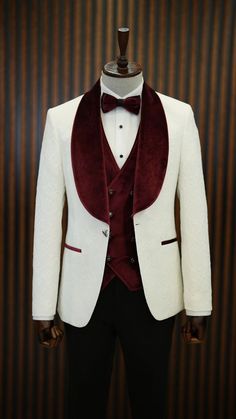 a white tuxedo with red velvet lapel collar