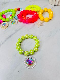 Our bracelets are beautifully crafted and handmade! Using high end beads, charms, & embellishments! They are truly fun and crafted in excellence Unique styles and colors are chosen and put together to create a luxurious and one of a kind experience!~ The styles are versatile and range from chic, girly, edgy, neutral, & western! They don't last long and are always limited edition! Measure: on average 6.75-9.5 with stretch! AllJewelry ~Final Sale~ Warning: Screen Resolutions & Lighting may vary th Fun Green Bracelet Jewelry, Playful Round Beaded Jewelry, Fun Beaded Bracelets For Party, Fun Round Beads Bracelets For Party, Playful Bracelet Jewelry For Jewelry Making, Green Beaded Jewelry For Birthday, Green Colorful Beads Jewelry For Birthday, Green Jewelry With Colorful Beads For Birthday, Playful Jewelry With Charms And Round Beads