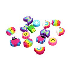 a bunch of toys that are in the shape of rainbows and clouds on a white background