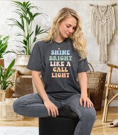 "Funny nursing shirt Shine Bright Like a Call Light Sarcastic nurse Gift Nurse Aide Aid Tech ER ICU, Nursing School Graduate gift. PRODUCTION TIME: 1-3 days (Usually 2 days) SHIPPING TIME: 2-5 days (Usually 3 days) DESIGN COLOR: BLACK DESIGN is used by for White, Athletic Heather Pink, Heather Peach, Heather Dusty Blue, Heather Prism Dusty Blue, Lilac. WHITE DESIGN is used by Other Colored Shirts. PRODUCT DESCRIPTION: SOFT T-SHIRT FOR ADULTS AND UNISEX T-shirts are designed and manufactured in the best way possible and made of premium quality ring-spun cotton. The garment (Bella+Canvas) fits perfectly and feels soft and comfortable. The style of the vinyl and the garment can be chosen according to your taste. - For the best quality materials, we offer very fast dispatching and posting serv Casual Nursing Friendly Short Sleeve T-shirt, Casual Crew Neck Nursing Friendly T-shirt, Casual Relaxed Fit Nursing T-shirt, Relaxed Fit Nursing Top With Short Sleeves, Casual Nursing Shirt With Short Sleeves, Casual Short Sleeve Nursing Shirt, Nurse Aide, Nicu Nursing, Funny Nursing