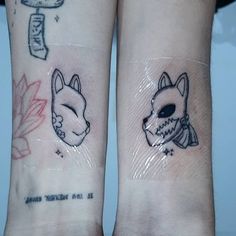 two small tattoos on both arms with foxes and flowers in the middle one has an arrow