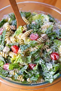 a salad with pasta, meat and vegetables in it