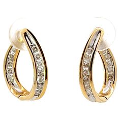 Earrings Specifications: Metal: 14k Yellow Gold Earring Length: 17.4 mm Total Weight: 3.4 Grams Diamonds: 24 Diamond Color: G-H Diamond Clarity: SI Diamond Carat Weight: 0.20 carats Condition: Preowned Stamped: "14k" Gold Earring, Yellow Gold Earring, Diamond Color, Jewelry Earrings Hoops, Diamond Clarity, Colored Diamonds, Metallica, Jewelry Earrings, Hoop Earrings