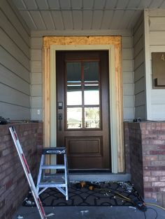 the front door of a house is being painted