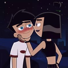 two cartoon characters are kissing in the dark