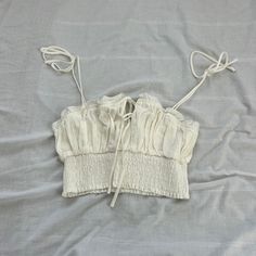 Princess Polly Crop Top Size 4 Condition: Nwot Color: White Details : - Smocked Bottom - Lined - Self-Tie Sleeves Extra: - I Ship Between 1-2 Days White Summer Tops With Drawstring, White Smocked Back Crop Top For Summer, White Smocked Bodice Crop Top, Spring Ruched Cotton Crop Top, Fitted White Top With Elastic Neckline, Fitted White Tops With Elastic Neckline, Cotton Smocked Ruched Stretch Top, White Smocked Bodice Crop Top For Summer, White Smocked Back Crop Top For Day Out