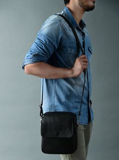 The Enzo black leather messenger bag for men is a versatile and stylish accessory designed to carry essentials in a convenient and fashionable manner. Crafted from high-quality, durable leather, it exudes a sleek, professional appearance. The bag typically features an adjustable shoulder strap for comfortable carrying, and multiple compartments and pockets for organized storage. Its spacious interior can accommodate documents, phones and personal items. The classic black color complements variou Business Crossbody Camera Bag, Functional Laptop Bag With Adjustable Strap, Black Leather Laptop Bag For Everyday Carry, Black Leather Laptop Bag For Everyday, Black Briefcase With Adjustable Strap For Everyday Carry, Functional Black Leather Camera Bag, Black Satchel With Leather Lining For On-the-go, Functional Briefcase For On-the-go, Black Leather Pouch With Adjustable Strap