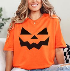 -PLEASE CONTACT WITH ME IF YOU HAVE QUESTIONS! -Pumpkin Face Shirt, Pumpkin Shirt, Halloween Shirt, Scary Pumpkin Shirt, Halloween Gift, Halloween Party Outfit, Pumpkin Tee, Spooky Season  -We use Crewneck Colors Heavyweight t-shirts for all listings labeled with Comfort Colors. These shirts are Unisex and designed to be loose-fitting. For a tighter fit, consider ordering one size smaller. Since each shirt is customized to your preferences, returns or exchanges are not feasible. Please review ou Halloween Short Sleeve Pre-shrunk T-shirt, Pumpkin Face Tshirt, Halloween Yellow Graphic Print T-shirt, Halloween Party Outfit, Orange Halloween T-shirt With Funny Print, Spooky Orange Fall T-shirt, Halloween Party Outfits, Pumpkin Face, Scary Pumpkin