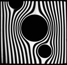 an abstract black and white photo with circles in the center, as well as stripes