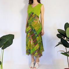 "Vintage patchwork maxi dress Amazing patchwork chiffon dress with a pointed empire waistline and a knit green bodice. Has a v-neckline and scalloped hems. The knit top is chartreuse green, the skirt has multiple shades of green, pinks, orange & maroon. Has a green chiffon lining in the skirt area. Made in the early 2000s by Aldo Martin's, made in Spain. Perfect condition Measurements are taken flat Full measurements provided Stretch is included in measurements Tag size: 10 (medium) Chest: 32\"-36\" Waist: 30\"-34\" Hip: 42\"-44\" Length (shoulder to hem)- 49\" Fabric content: cotton bodice, polyester skirt" Adjustable Sawhorse, Knit Patchwork, Dress Y2k, Chartreuse Green, Empire Waistline, Vintage Patchwork, Green Outfit, Scalloped Hem, Vintage Knitting