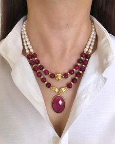 Genuine Pearl and Pink Tiger's Eye Pendant Necklace ✅ NECKLACE FEATURES * Handmade item * Materials: 8 mm pink fuschia color tiger's eye high quality natural stone, freshwater pearl, gold-plated dorica, details and chain * Length: 43 cm/17 inches + 5 cm/2 inch adjustment chain. If you need a longer additional extension chain, please inform me.  * There may be some color discrepancies due to different monitor settings. * Please note that natural stones may vary slightly in size, shape, and color tones from each other due to their natural characteristics. These small differences make your jewelry special and unique. ⭐️ This elegant two-strand necklace is designed with pearls and fuchsia tiger's eye natural stones. The vibrancy of the fuchsia color combined with the elegance of pearls makes t Red Pearl Necklace For Festive Gift, Red Pearl Necklace Gift For Festive Occasions, Festive Red Pearl Necklace As Gift, Festive Red Pearl Necklace Gift, Festive Red Pearl Necklace For Gift, Pink Pearl Necklace For Festive Gift, Ruby Pendant Necklace, Handmade Pearl Jewelry, Fuschia Color