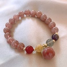 Juicy, sweet and delicious! While giving you energy, these adorable Peach • Strawberry crystal & Agate Bracelet add a cute touch to any outfit. Natural strawberry crystal, red agate, moonstone Bead diameter: 8 mm Premium zinc alloy Elastic - Suitable for hand circumference: 14-18 CM Hypoallergenic, lead & nickel free *We carefully select each gemstone to offer gems with the best quality. As gemstones are natural materials, stone colors may vary slightly from the images, making this beautiful bracelet completely unique, just like you!If you aren't in LOVE with your purchase, please let us know within 30 days of receiving your item, and you'll receive a stress-free refund. Red Natural Stones Crystal Bracelet Gift, Red Crystal Bracelet With Natural Stones For Gift, Agate Gemstone Beaded Bracelets As Gift, Gift Agate Beaded Crystal Bracelet, Agate Bracelets As A Gift, Rose Quartz Round Crystal Bracelet Gift, Round Agate Bracelet Gift, Casual Rose Quartz Jewelry Gift, Round Agate Crystal Bracelet Gift