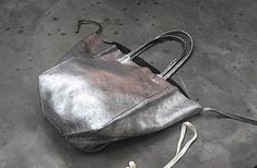 Silver Tote Bag With Leather Handles, Silver Bags With Leather Handles For Daily Use, Silver Bags With Leather Handles For Shopping, Silver Shoulder Bag With Leather Handles For Shopping, Daily Use Silver Bags With Leather Handles, Silver Leather Bags With Leather Handles, Handmade Silver Shoulder Bag For Everyday Use, Silver Handmade Shoulder Bag For Everyday Use, Silver Leather Shoulder Bag As Gift