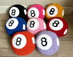 eight ball pool balls laid out on the floor with numbers 8 - 8 in them