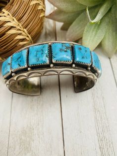 Pre-owned ETHNIC & REGIONAL STYLE : Native American COLOR : Blue MAIN STONE COLOR : Turquoise METAL : Sterling Silver MAIN STONE : Turquoise SETTING STYLE : Cluster BRAND : Nizhoni Traders LLC LOT : No JEWELRY TYPE : Bracelets TYPE : Bracelet STYLE : Cuff BASE METAL : Sterling Silver FEATURED REFINEMENTS : Navajo Sterling Silver Jewelry TRIBAL AFFILIATION : Navajo Awesome Vintage Old Pawn Navajo Kingman Turquoise and Sterling Silver Cuff Bracelet. Beautiful stones in this cuff! This cuff has an Artisan Blue Cuff Bangle Bracelet, Artisan Blue Bangle Cuff Bracelet, Southwestern Blue Cuff Bracelet As Gift, Southwestern Blue Cuff Jewelry, Blue Artisan Cuff Jewelry, Artisan Blue Cuff Jewelry, Artisan Blue Cuff Bracelet, Artisan Blue Bracelets Collectible, Vintage Blue Cuff Jewelry