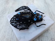 Buy an exclusive gift for your loved one - Gemstone embroidered beetle jewelry!   Cicada brooch, Beetle brooch pin,may bug pin is   -------     HAND CRAFTED,HAND STITCHED original design----- The Embroidered insect cicada brooch pin will be well combined with an evening dress, a winter coat, business suit, warm sweater or as shawl brooch, making a final note in your unique style. Looks very naturalistic and elegant.     The insect pin is made of high-quality materials: Swarovski crystals, Japane Unique Handmade Black Brooches, Handmade Black Brooches As Gift, Unique Black Brooches For Gifts, Embroidered Beetle, Cicada Brooch, Shawl Brooch, Beetle Jewelry, Brooch Making, Beetle Brooch