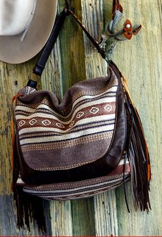 Leather Fringed Serape Purse Brown Leather Handwoven Hobo Bag, Brown Handwoven Leather Hobo Bag, Bohemian Shoulder Bag With Tassels For Fall, Bohemian Shoulder Bag With Leather Trim, Bohemian Fall Bags With Tassels, Brown Fringe Hobo Shoulder Bag, Brown Fringe Tote Shoulder Bag, Bohemian Tote Shoulder Bag With Leather Trim, Bohemian Hobo Bag With Fringe For Travel