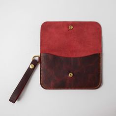 The wristlet clutch is our most versatile leather clutch, with plenty of space for your cards, keys, and phone. It's made of the same beautiful full-grain leathers as our bestselling leather tote bags and can be embossed with your initials at no additional charge. It measures 8.5 inches by 5.25 inches, with a 5.5-inch wristlet strap. Leather Clutch Pouch With Interior Card Slots, Leather Wristlet With Removable Pouch For Daily Use, Leather Pouch With Interior Card Slots, Rectangular Wristlet With Card Slots For Everyday Use, Rectangular Wristlet With Interior Card Slots For Everyday Use, Leather Rectangular Wristlet With Removable Pouch, Leather Travel Wristlet Pouch, Everyday Rectangular Wristlet With Card Slots, Leather Coin Purse With Smooth Grain For Everyday Use