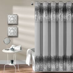 a white shower curtain with black lace on it