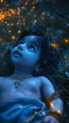 a woman laying in the grass with her eyes closed and glowing lights around her head