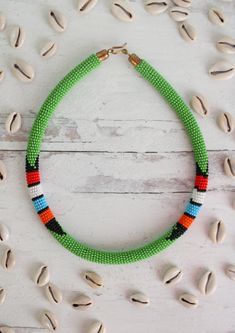 Classic Maasai beaded necklace. Beautifully handmade my Kenyan artisans. Traditional Handmade Turquoise Beaded Necklaces, Traditional Handmade Long Beaded Necklace, Traditional Green Beaded Necklace For Festival, Traditional Beaded Chain For Beach, Traditional Handmade Beaded Necklace For Beach, Traditional Beaded Necklace For The Beach, Traditional Beaded Necklace For Beach, Handmade Green Bohemian Beaded Necklaces, Traditional Green Long Necklace Beads