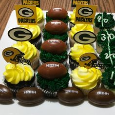 cupcakes with green and yellow frosting are arranged in the shape of footballs