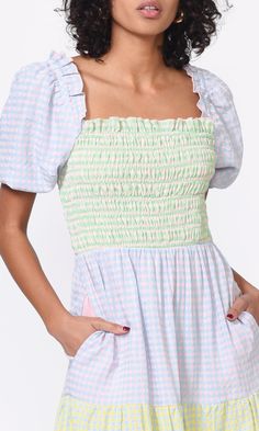 Gingham is having a comeback and we're all for it. The Nola Dress is made of a colorblock gingham fabrication and features a smock paneling along top, puff sleeves with ruffle detailing, shirring along skirt seam, and is finished with an invisible zipper closure along the back. Gingham print dress Colorblock Puff sleeves Smocked Midi length Pleated Side pockets Lined Length: 48" Self: 50% Polyester, 50% Rayon; Lining: 100% Polyester Machine wash cold gentle cycle. Dry flat. Do not use chlorine-b Smocked Top, Gingham Dress, Gingham Print, Colorblock Dress, Dresses Xs, Puff Sleeves, Modern Woman, Sky Blue, Smocking