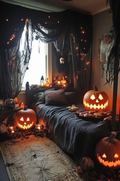 a room decorated for halloween with pumpkins on the floor and lights in the windows