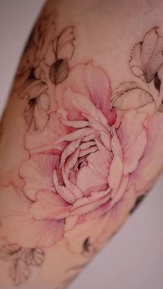 a woman's arm with flowers on it