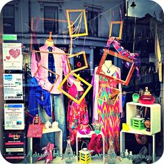 a window display with mannequins and other items