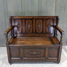 an old wooden bench with ornate carvings on it