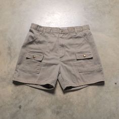 Vintage 70s khaki hiking shorts. Good worn vintage condition with some abrasions on the left thigh. Please see full measurements below.  Waist: 34" Rise: 11.5" Inseam: 4.5" Outseam: 15" If you would like to see additional photos or have any other questions, please do not hesitate to ask, and thanks for looking! Shipping disclaimer: All domestic orders under 16oz ship USPS Ground Advantage. All domestic orders over 16oz ship USPS priority mail. All international orders under 4lbs ship via Etsy's Vintage Khaki Short Bottoms, Military Cargo Shorts, Military Cargo Shorts For Outdoor, Military Style Cotton Cargo Shorts With Patch Pockets, Shorts Cargo, Hiking Shorts, Khaki Military Cotton Shorts, Khaki Shorts, Cargo Shorts