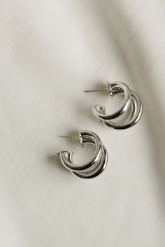 Classic + stylish -- our Triple Hoop Earrings are versatile for everyday wear. Whether they are dressed up or down, they make the perfect accessory. Available in both gold + silver. Includes two gold or silver plated triple hoop earrings Size Diameter: 20mm Width Diameter: 15mm All materials are lead & nickel free Silver Gold Earrings, Triple Hoop Earrings, Everyday Wear Jewelry, Perfume Spray, Jewelry Companies, Dream Jewelry, Earrings Collection, Ear Jewelry, Silver Hoops