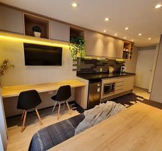 the kitchen is clean and ready to be used as a living room or dining area