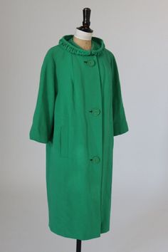 Fab 1950s original green cocoon coat (colour is more emerald I would say than it looks in the pictures). Coat has a button front fastening. Proper cocoon shape.  This is a light coat suitable for Spring or milder winter climates Label:  English Worsted Wool measures approx 24in pit to pit (so around a 48in bust at max?) 43in long  This lovely coat has been washed in a delicate cycle with cold water with an eco friendly soap with no fragrance. As a result the lining is wrinkled but can be steamed Vintage Green Spring Outerwear, Green Fitted Outerwear For Daywear, Vintage Green Long Coat, Cocoon Coat, Light Coat, Wool Vest, Silk Shirt, Body Size, Emerald Green