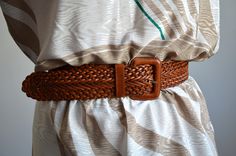 Vintage ESPRIT wide brown braided belt, from the 1990s era Women's brown woven leather belt with a leather-covered belt buckle and 1  leather loop. Perfect over a dress or an oversized shirt or a dress Size - 80 cm which is 31.5 inches Length (measured from the edge of the belt buckle to the end of the braided part and does not include the belt buckle) - 37 inches / 94 cm. Width of the leather strap - 2 inches / 5 cm Condition: Very good vintage condition with a some scratches on the leather buc Hippie Belt, Vintage Esprit, Braided Belt, Genuine Leather Belt, Warm Brown, Leather Buckle, The 1990s, To The End, Oversized Shirt