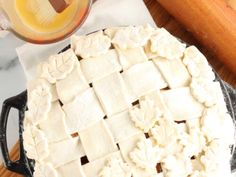 a pie sitting on top of a wooden cutting board