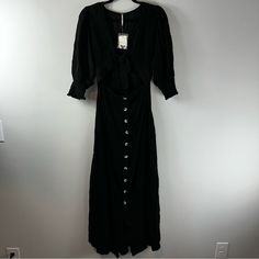 Free People String Of Hearts Black Maxi Dress Women Size M Size M Nwt The Dress Stretches. Length Measurement Is Inches 56 Inches Waist Measurement Is 12.5 Inches (25 Inches Total) Pit To Pit Measurement Is 16 Inches Sleeve Measurement Is 18 Inches 1020-2 All Offers Are Welcome! Fitted Black Rayon Maxi Dress, Black Fitted Maxi Dress With Buttons, Fitted Black Maxi Dress With Buttons, Black Fitted Rayon Dress, Black Rayon Midi Dress For Day Out, Black Buttoned Dresses For Brunch, Black Maxi Dress With Buttons For Daywear, Black Rayon Maxi Dress With Short Sleeves, Black Buttoned Maxi Dress For Daywear