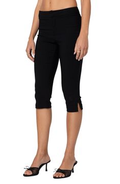 Stretchy capri pants bring a chic look and ultracomfort to every ensemble. Zip fly with hook-and-bar closure 45% cotton, 45% polyester, 10% spandex Machine wash, dry flat Imported Versatile Black Capri Bottoms, Versatile Black Capri-length Bottoms, Black Knee-length Capris For Summer, Stretch Cotton Capris For Work, Versatile Black Capris For Spring, Versatile Black Spring Capris, Black Capri Length Bottoms For Spring, Fitted Cotton Capris, Versatile Cotton Capri Length Bottoms