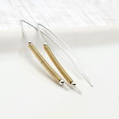 Silver and Gold Open Hoop Wishbone Style Earrings - These Sterling Silver threader earrings are wrapped with a 14k Gold Filled coil and sterling Silver beads. * Made to order and ships within 2 business days * Approximately 1.5" long * Earrings are made from quality Sterling Silver and 14k Gold filled. * Polished to a high shine * Choice of earring packaging with fun quotes! (Picture 3) These are thoughtfully handmade in my mountain studio at time of order, making each one unique. Nothing in my Adjustable Handwoven Brass Earrings, Earring Packaging, Modern Sterling Silver Nickel-free Threader Earrings, Silver Spiral Brass Earrings, Nickel-free 14k Gold-filled Gold Threader Earrings, Silver Wire-wrapped Sterling Silver Linear Earrings, Silver Threader Earrings, Mixed Metal Earrings, Open Hoop Earrings